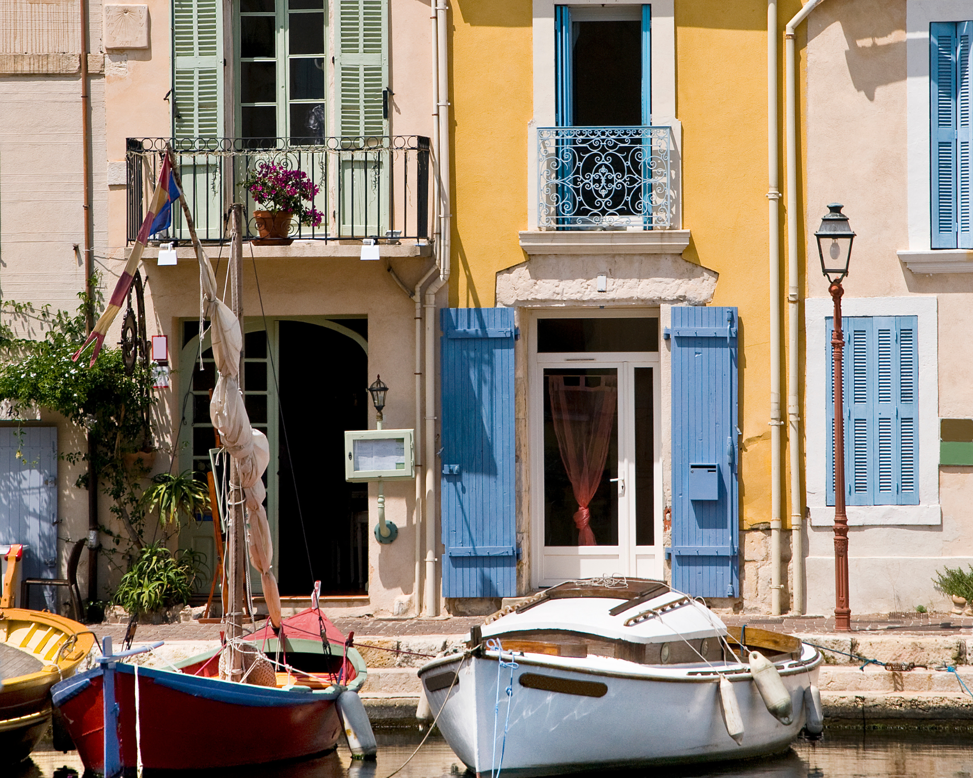 Little harbor in the south of France with colorful boats and colorful houses